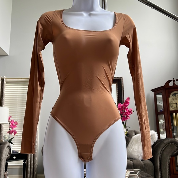 SKIMS Tops - SKIMS Long Sleeve Bodysuit in Tan
